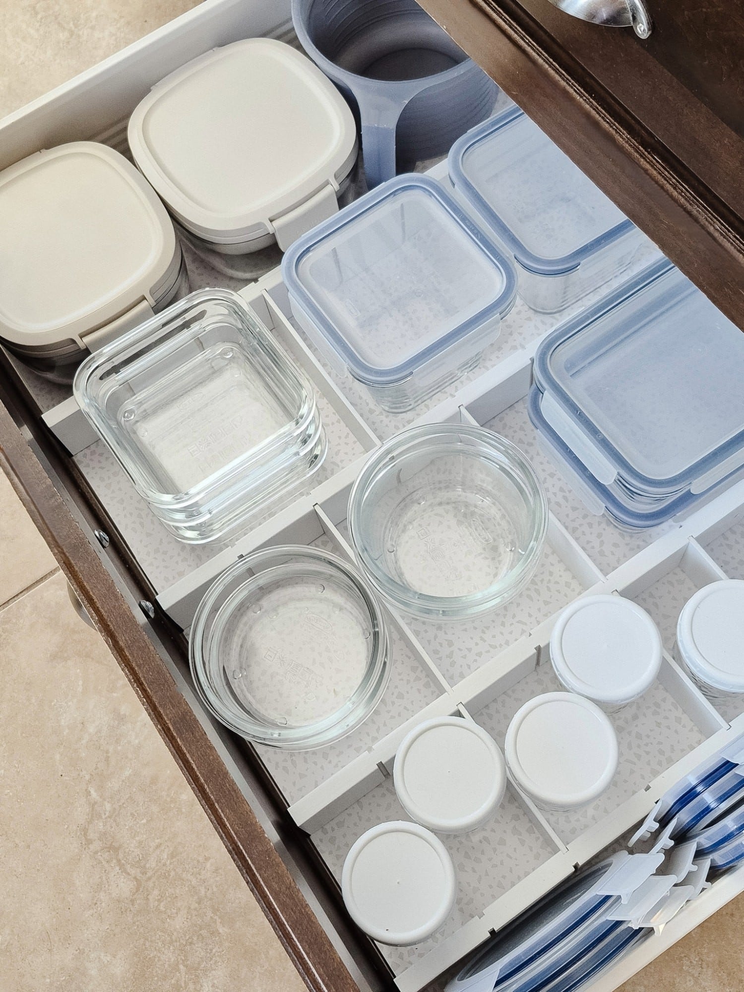 organizing food storage containers in drawer
