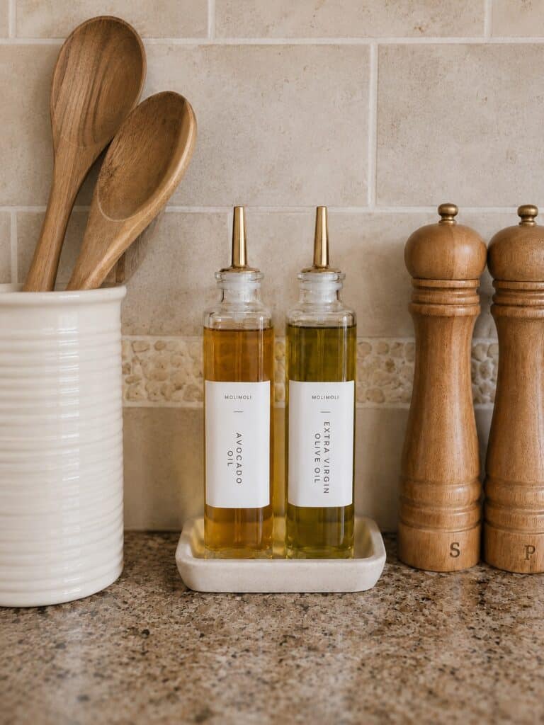 clutter free home_gold tone oil dispenser and salt and pepper shakers
