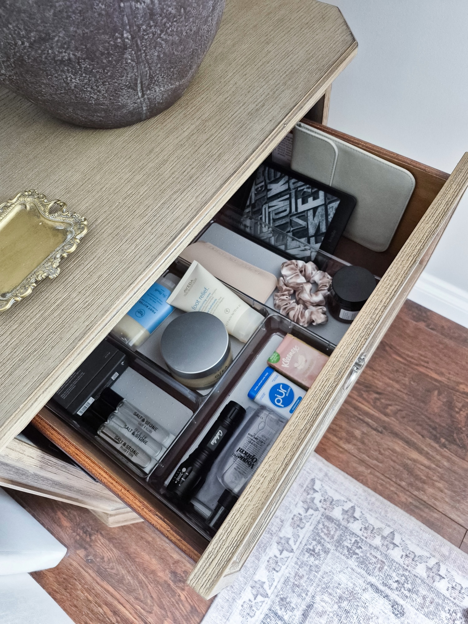 nightstand drawer organized with essentials