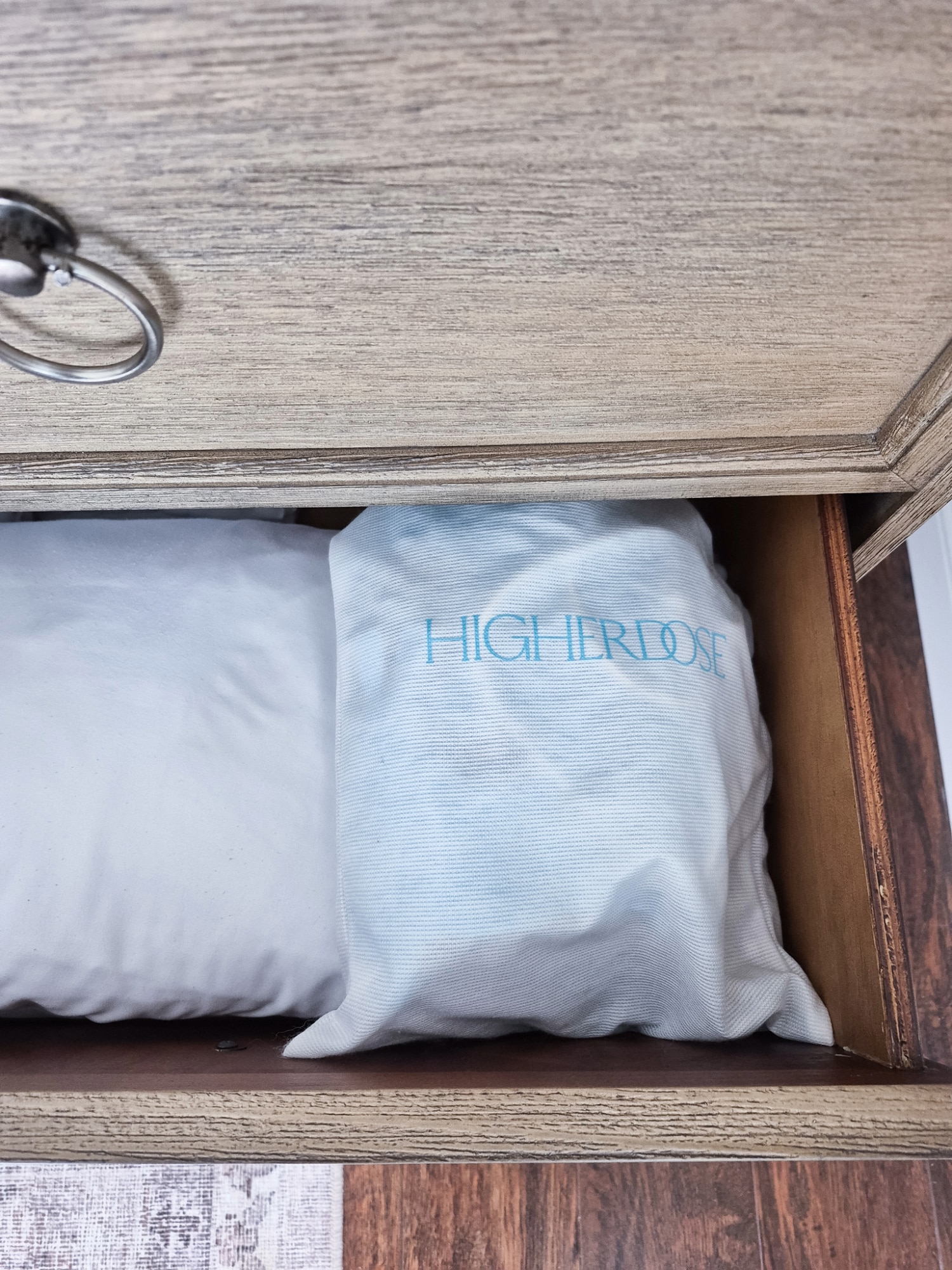 higher dose mask and bedsheets in nightstand drawer